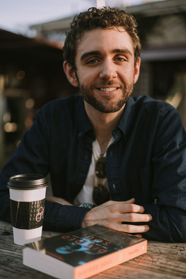 Dating profile photo with coffee, taken by The Match Artist